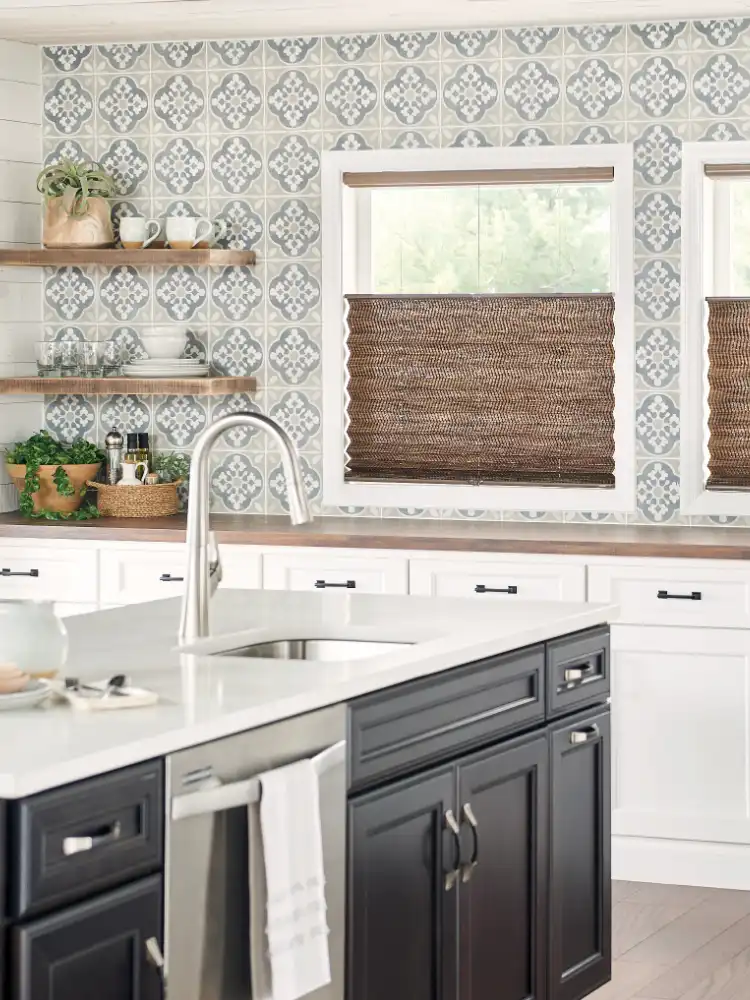 white countertops in kitchen with blinds. 